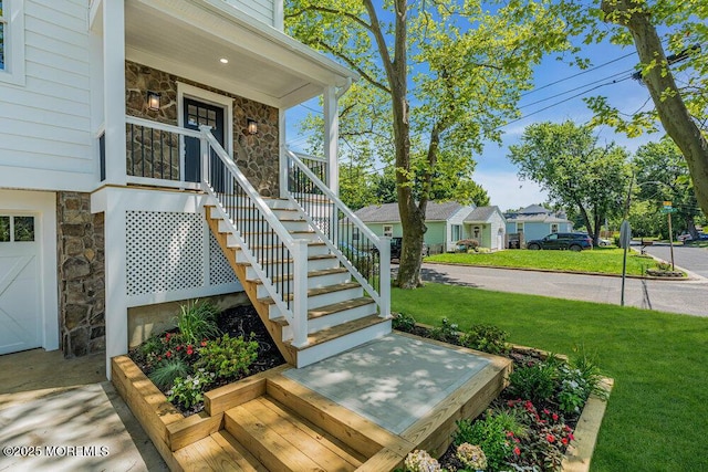 45 Shore Acres Ave, North Middletown, NJ 07748 - doorway to property with stone siding, a yard, and a residential view
