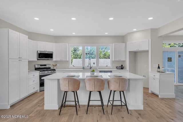 45 Shore Acres Ave, North Middletown, NJ 07748 - kitchen featuring stainless steel appliances, a center island, plenty of natural light, white cabinetry, and recessed lighting