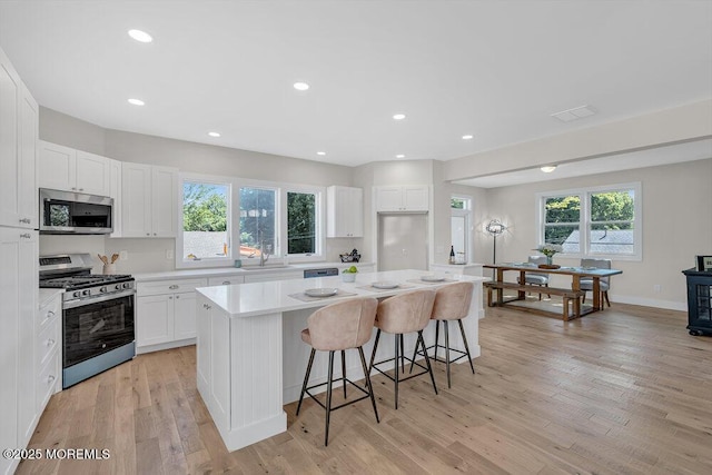 45 Shore Acres Ave, North Middletown, NJ 07748 - kitchen with appliances with stainless steel finishes, a kitchen island, light countertops, healthy amount of natural light, and recessed lighting