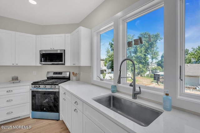 45 Shore Acres Ave, North Middletown, NJ 07748 - kitchen with appliances with stainless steel finishes and white cabinets