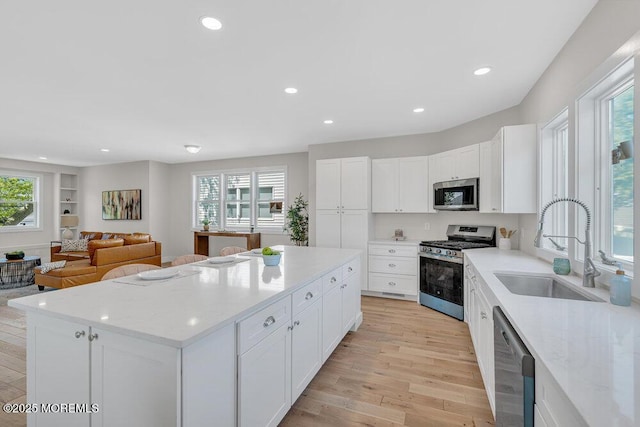 45 Shore Acres Ave, North Middletown, NJ 07748 - kitchen featuring stainless steel appliances, a kitchen island, plenty of natural light, light wood-style flooring, and recessed lighting
