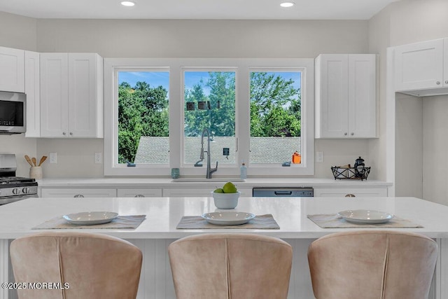 45 Shore Acres Ave, North Middletown, NJ 07748 - kitchen featuring stainless steel appliances, light countertops, a kitchen island, white cabinets, and recessed lighting