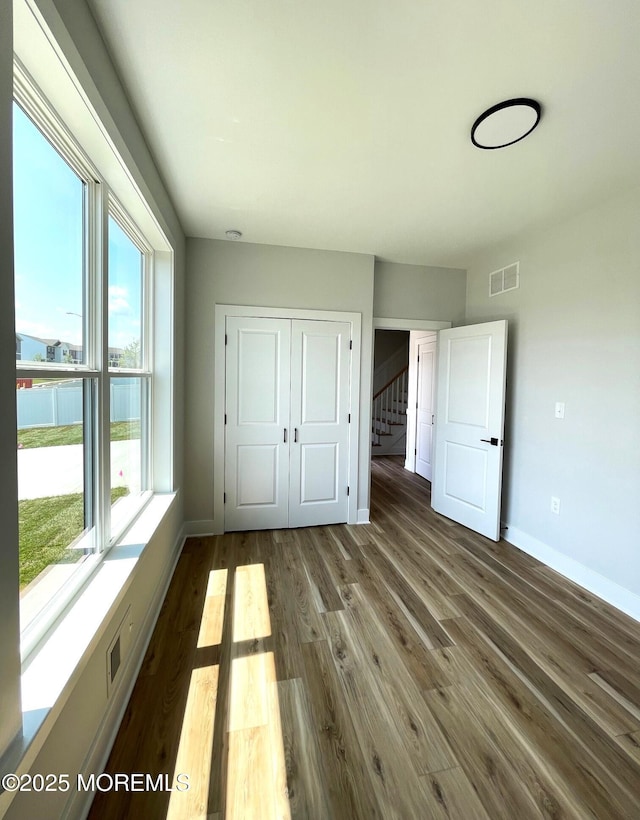12 Outsail Ave, Barnegat, NJ 08005 - unfurnished bedroom with dark wood finished floors and a closet