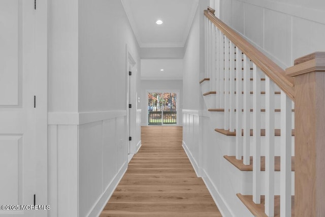 12 Outsail Ave, Barnegat, NJ 08005 - hall featuring ornamental molding, wood finished floors, a decorative wall, wainscoting, and stairs