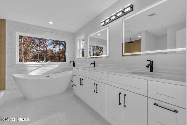 12 Outsail Ave, Barnegat, NJ 08005 - bathroom featuring marble finish floors, a freestanding bath, double vanity, and recessed lighting