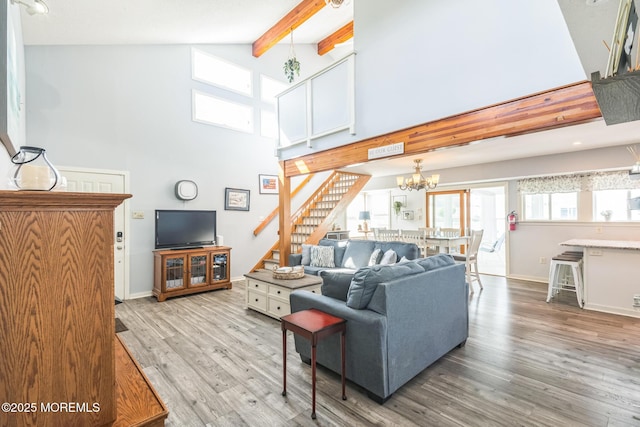 887 Beach Haven W Blvd, Manahawkin, NJ 08050 - living room featuring high vaulted ceiling, stairway, beam ceiling, wood finished floors, and a chandelier