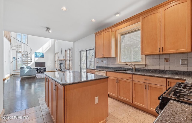 408 Brookdale Ave, Long Branch, NJ 07740 - kitchen with a center island, backsplash, dark stone countertops, open floor plan, and recessed lighting