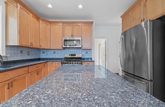 408 Brookdale Ave, Long Branch, NJ 07740 - kitchen featuring stainless steel appliances, dark stone counters, decorative backsplash, and recessed lighting