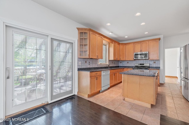 408 Brookdale Ave, Long Branch, NJ 07740 - kitchen with stainless steel appliances, healthy amount of natural light, tasteful backsplash, glass insert cabinets, and recessed lighting