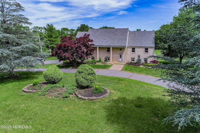 67 School Rd E, Marlboro, NJ 07746 - view of front of property with a front lawn and a shingled roof