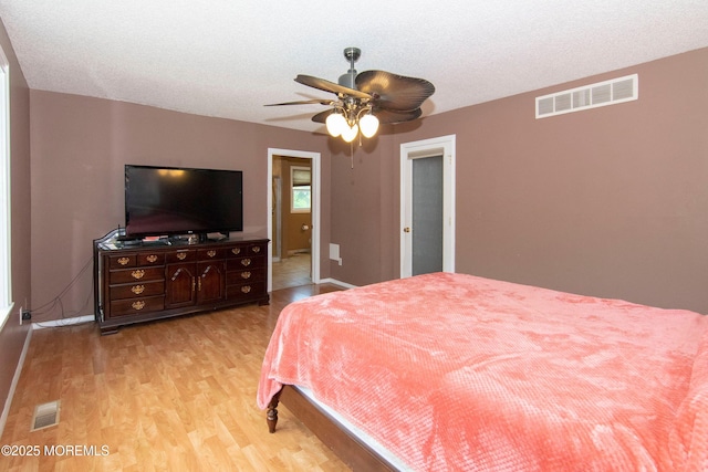67 School Rd E, Marlboro, NJ 07746 - bedroom with light wood finished floors and a ceiling fan