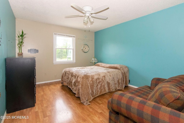 67 School Rd E, Marlboro, NJ 07746 - bedroom with light wood finished floors and ceiling fan