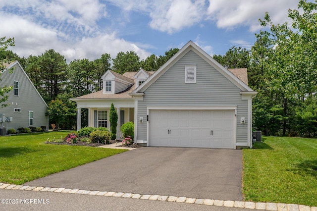 5 Gainsborough Ln, Manchester, NJ 08759 - view of front of house featuring asphalt driveway, a front lawn, and a garage