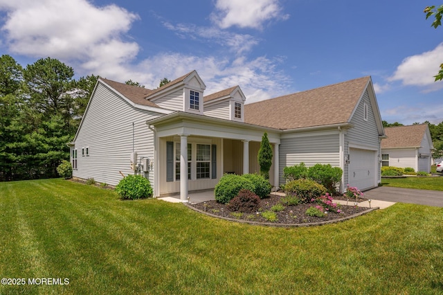 5 Gainsborough Ln, Manchester, NJ 08759 - view of property exterior featuring a lawn, a garage, asphalt driveway, and a shingled roof