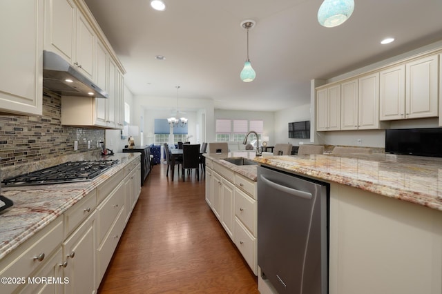 5 Gainsborough Ln, Manchester, NJ 08759 - kitchen featuring stainless steel appliances, under cabinet range hood, backsplash, a chandelier, and wood finished floors