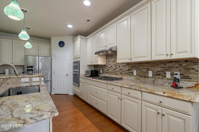 5 Gainsborough Ln, Manchester, NJ 08759 - kitchen featuring appliances with stainless steel finishes, under cabinet range hood, decorative light fixtures, decorative backsplash, and recessed lighting