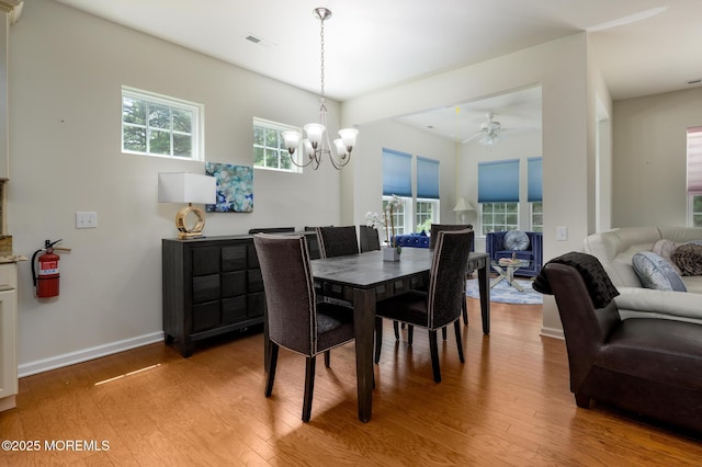5 Gainsborough Ln, Manchester, NJ 08759 - dining area with light wood finished floors, a chandelier, and a ceiling fan