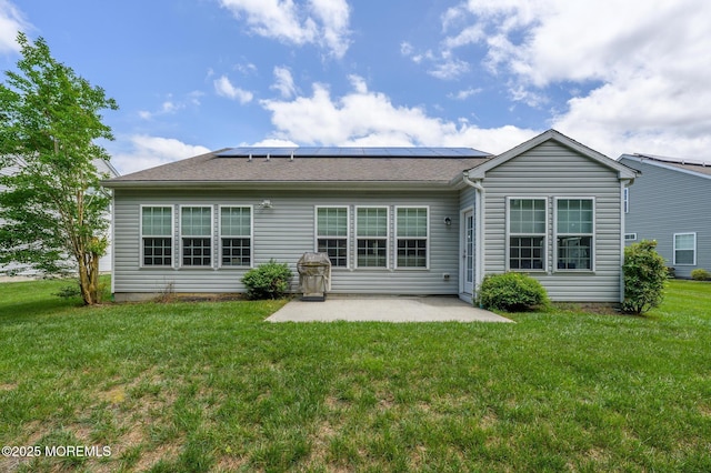 5 Gainsborough Ln, Manchester, NJ 08759 - rear view of house with a patio, a yard, and solar panels