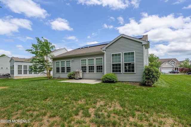 5 Gainsborough Ln, Manchester, NJ 08759 - back of house with solar panels, a patio area, and a yard