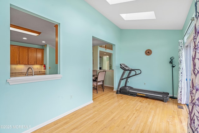 3 Knightsbridge Pl, Jackson, NJ 08527 - workout room with a skylight, wood finished floors, and vaulted ceiling