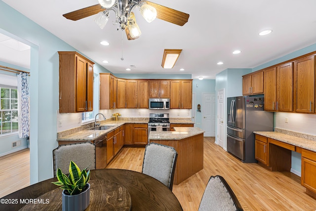 3 Knightsbridge Pl, Jackson, NJ 08527 - kitchen with appliances with stainless steel finishes, brown cabinetry, light wood-style flooring, tasteful backsplash, and recessed lighting