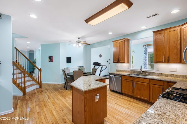 3 Knightsbridge Pl, Jackson, NJ 08527 - kitchen featuring stainless steel dishwasher, a kitchen island, a ceiling fan, and brown cabinetry