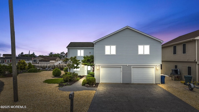 28 S Dayton Dr, Little Egg Harbor, NJ 08087 - view of front of house featuring decorative driveway and an attached garage