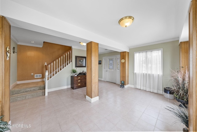 28 S Dayton Dr, Little Egg Harbor, NJ 08087 - entryway with crown molding, stairs, decorative columns, light tile patterned floors, and wood walls