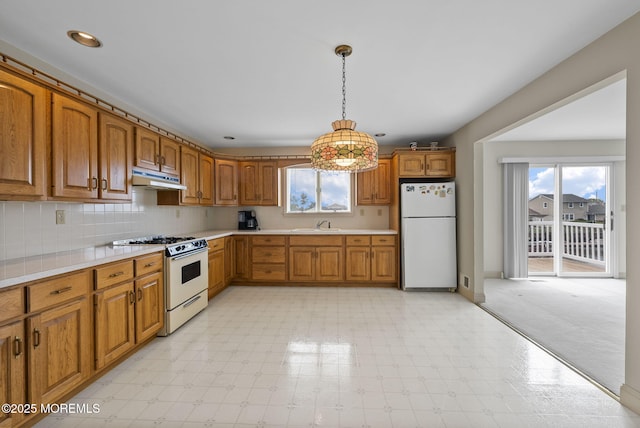 28 S Dayton Dr, Little Egg Harbor, NJ 08087 - kitchen featuring white appliances, under cabinet range hood, brown cabinets, light countertops, and recessed lighting