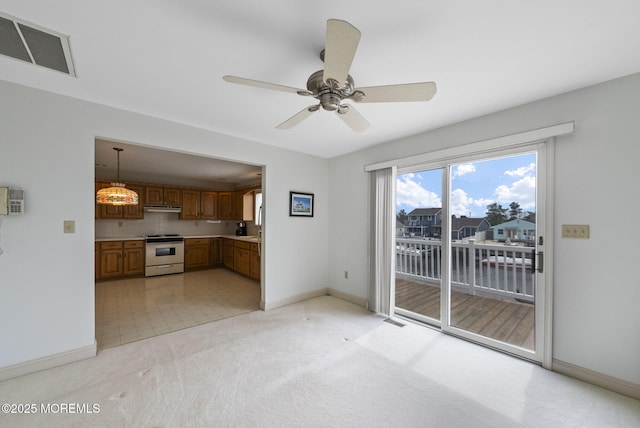 28 S Dayton Dr, Little Egg Harbor, NJ 08087 - unfurnished living room with a ceiling fan, light carpet, and a water view
