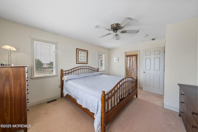 28 S Dayton Dr, Little Egg Harbor, NJ 08087 - bedroom featuring light carpet, multiple windows, and a ceiling fan