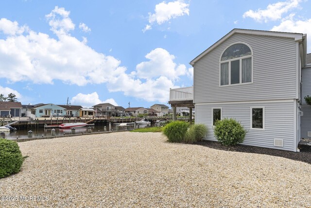 28 S Dayton Dr, Little Egg Harbor, NJ 08087 - view of yard with a residential view, a water view, and a dock