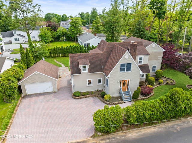 334 Norgrove Pl, Elberon, NJ 07740 - view of front of house with a shingled roof, a chimney, and a garage