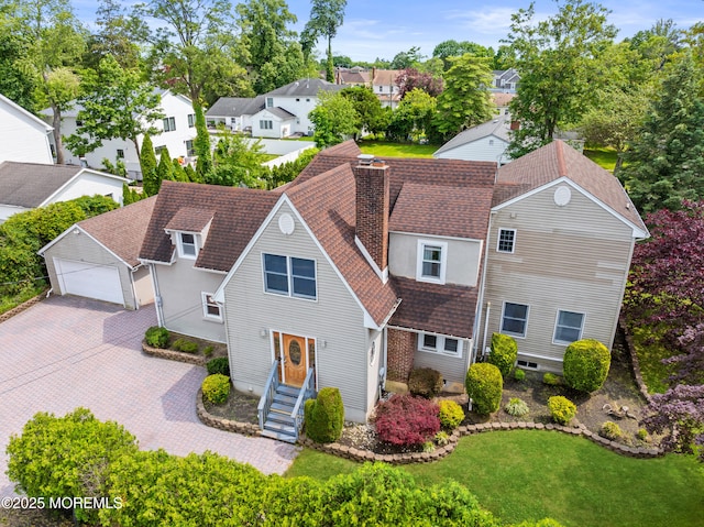 334 Norgrove Pl, Elberon, NJ 07740 - view of front of property featuring roof with shingles, a residential view, a chimney, a front yard, and a garage