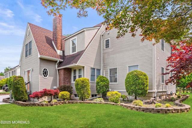 334 Norgrove Pl, Elberon, NJ 07740 - view of front facade with a front yard, a chimney, and a shingled roof