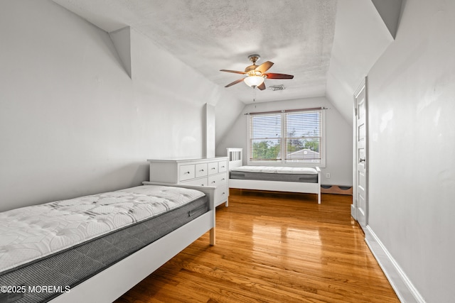 334 Norgrove Pl, Elberon, NJ 07740 - bedroom featuring vaulted ceiling, light wood-style flooring, ceiling fan, and a textured ceiling