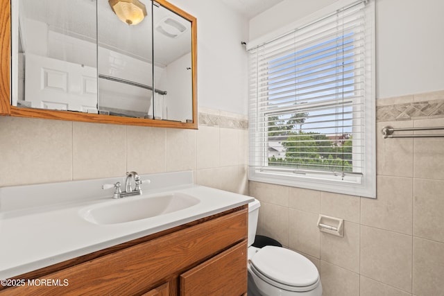 334 Norgrove Pl, Elberon, NJ 07740 - bathroom featuring tile walls, vanity, a shower, and a wainscoted wall
