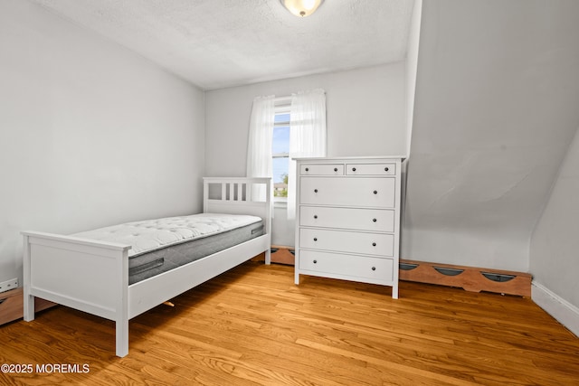 334 Norgrove Pl, Elberon, NJ 07740 - bedroom featuring light wood finished floors and a textured ceiling