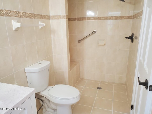 57 Turnberry Cir Unit 145, Toms River, NJ 08753 - bathroom featuring vanity, tiled shower, tile walls, and tile patterned floors