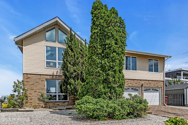 259 Cypress Dr, Bayville, NJ 08721 - view of front of home featuring brick siding, concrete driveway, and a garage