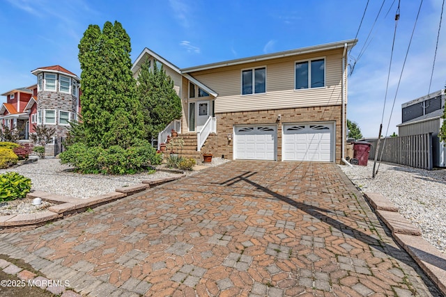 259 Cypress Dr, Bayville, NJ 08721 - view of front facade with a garage, driveway, and brick siding