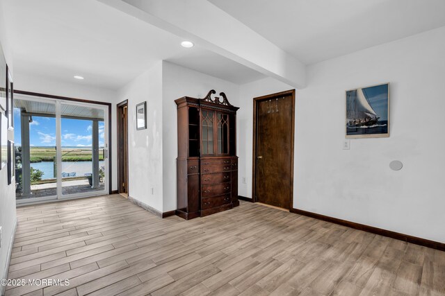 259 Cypress Dr, Bayville, NJ 08721 - spare room featuring light wood-type flooring, a water view, and recessed lighting