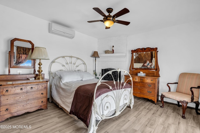 259 Cypress Dr, Bayville, NJ 08721 - bedroom featuring a wall mounted air conditioner, light wood finished floors, and a ceiling fan