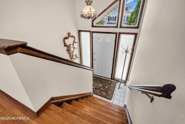 259 Cypress Dr, Bayville, NJ 08721 - entrance foyer featuring a chandelier, stairway, and light tile patterned floors