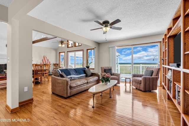 259 Cypress Dr, Bayville, NJ 08721 - living area featuring a ceiling fan, light wood finished floors, and a textured ceiling