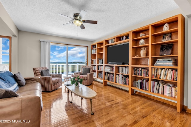 259 Cypress Dr, Bayville, NJ 08721 - living area with ceiling fan, a textured ceiling, and wood finished floors