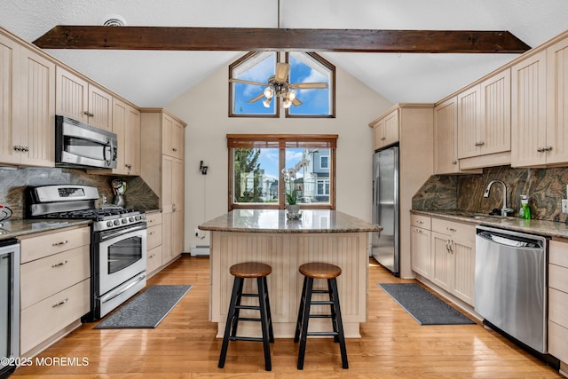 259 Cypress Dr, Bayville, NJ 08721 - kitchen with stainless steel appliances, a center island, ceiling fan, and light wood-type flooring