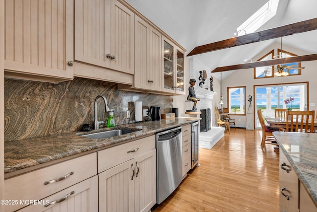 259 Cypress Dr, Bayville, NJ 08721 - kitchen with stainless steel dishwasher, backsplash, light wood finished floors, glass insert cabinets, and stone countertops