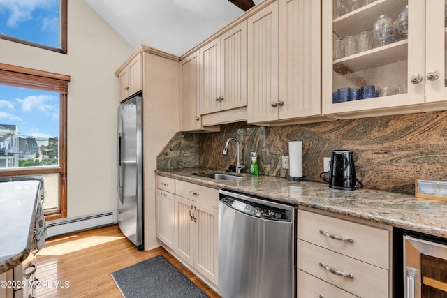 259 Cypress Dr, Bayville, NJ 08721 - kitchen with stainless steel appliances, baseboard heating, wine cooler, backsplash, and vaulted ceiling