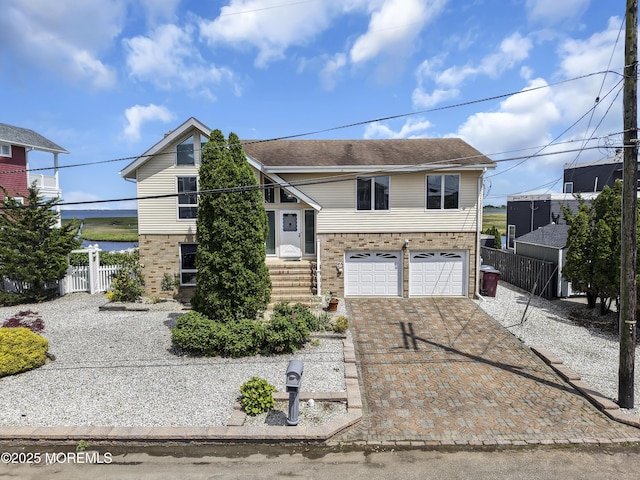259 Cypress Dr, Bayville, NJ 08721 - view of front of house featuring a garage, driveway, and brick siding